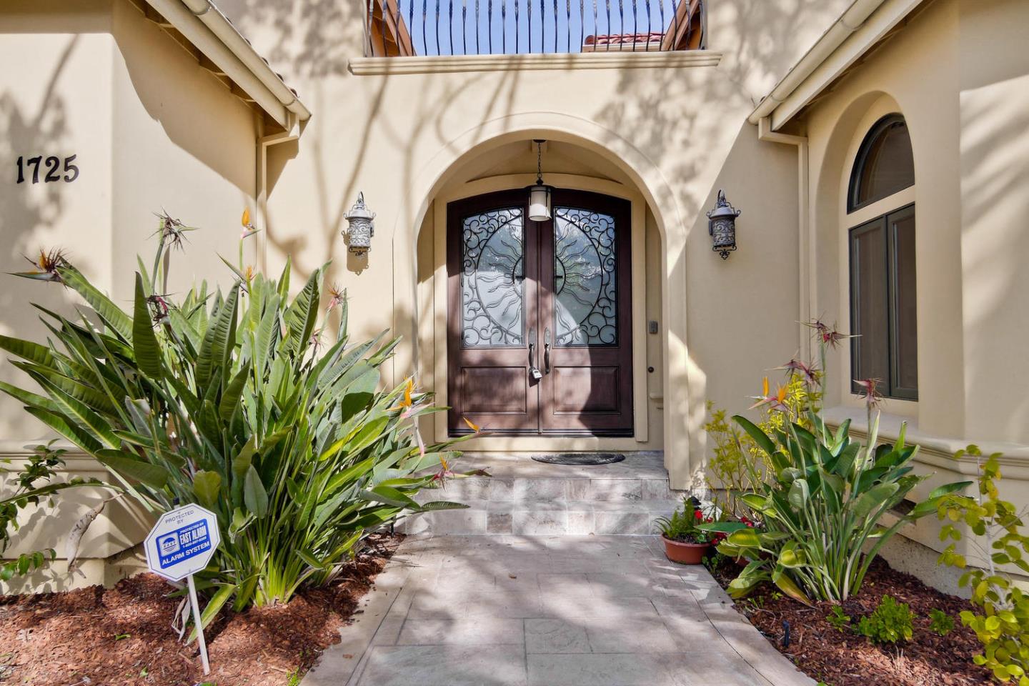 1725 Newell Road Palo Alto, CA 94303 - Photo 3 of 47 a front view of a house with garden