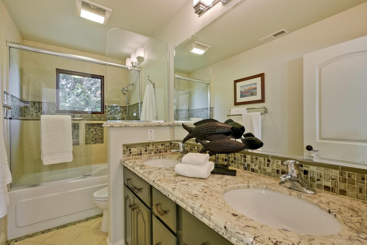 1725 Newell Road Palo Alto, CA 94303 - Photo 32 of 47 a bathroom with a granite countertop sink a large mirror a bathtub and next to a window