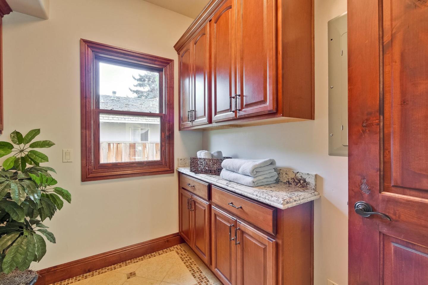 1725 Newell Road Palo Alto, CA 94303 - Photo 36 of 47 a kitchen with stainless steel appliances granite countertop a refrigerator a stove a sink and a window