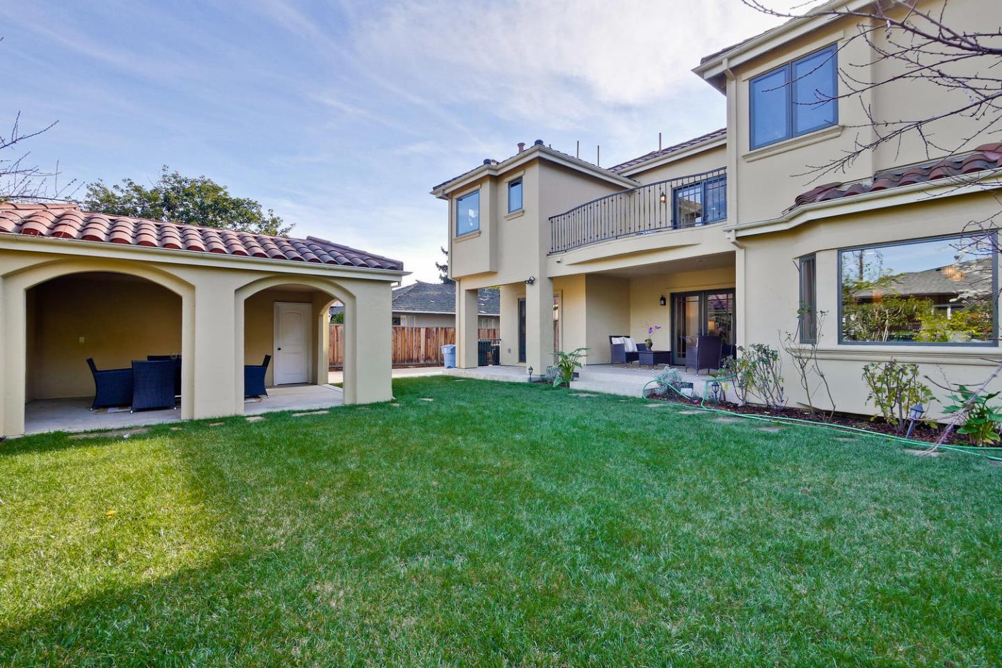 1725 Newell Road Palo Alto, CA 94303 - Photo 41 of 47 a front view of a house with a garden and yard