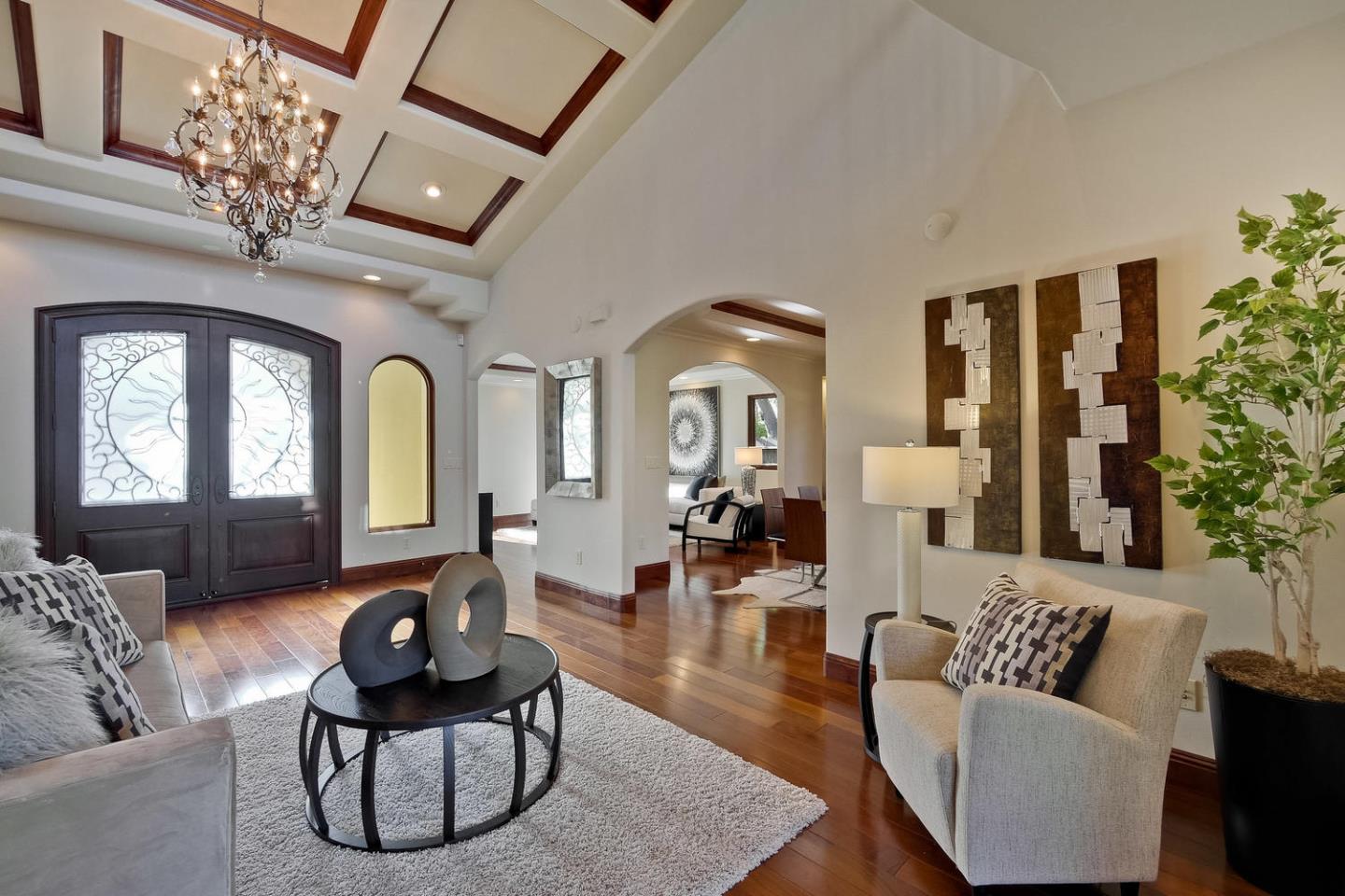 1725 Newell Road Palo Alto, CA 94303 - Photo 5 of 47 a living room with furniture chandelier and a rug