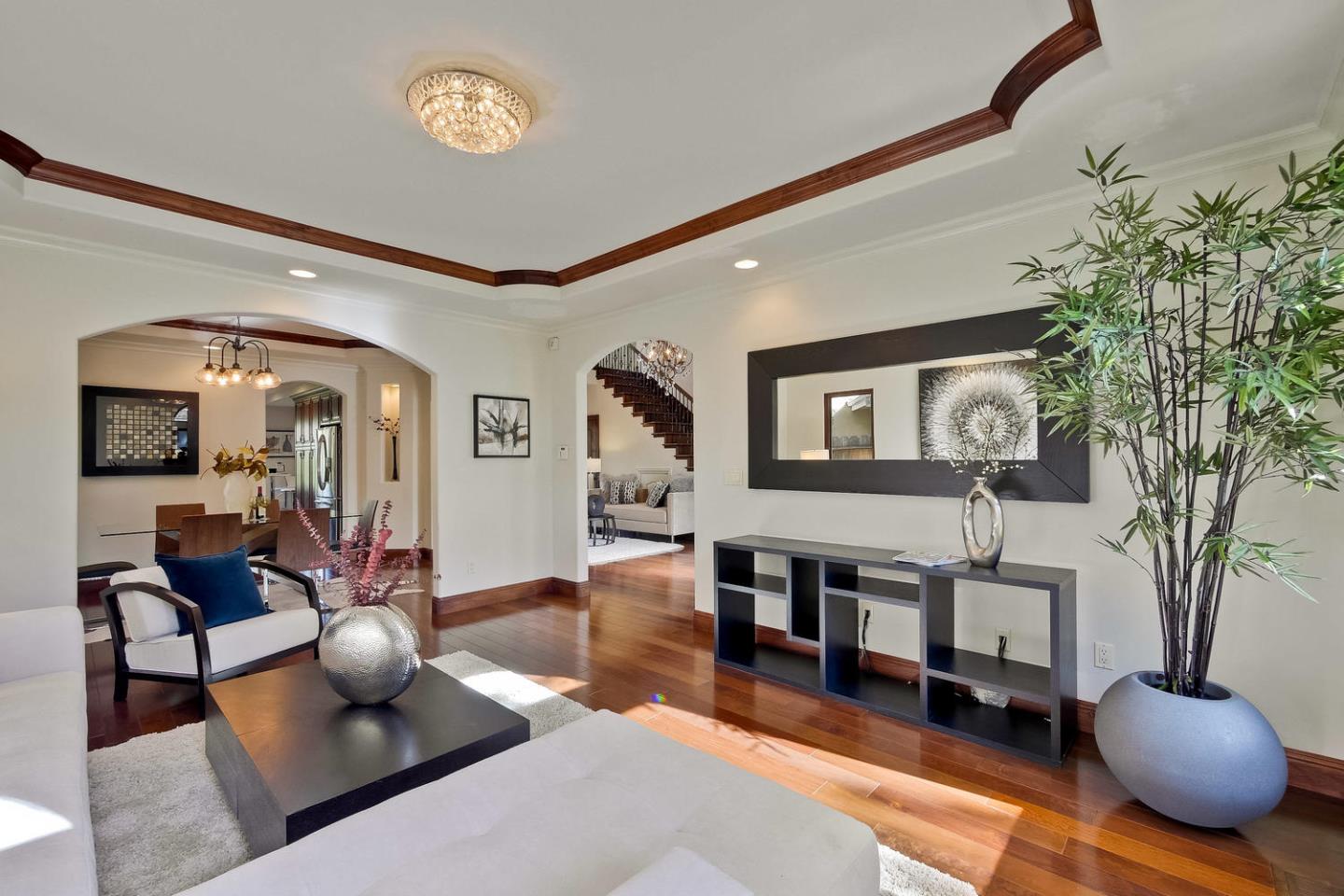 1725 Newell Road Palo Alto, CA 94303 - Photo 9 of 47 a living room with furniture and a chandelier