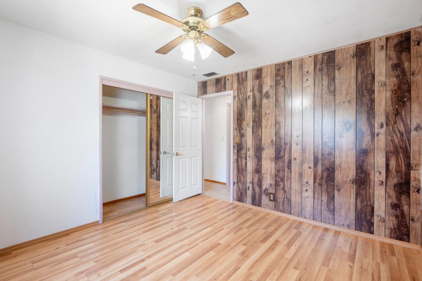 421 Fairview Drive Gilroy, CA 95020 - Photo 15 of 23 a view of a bedroom with wooden floor