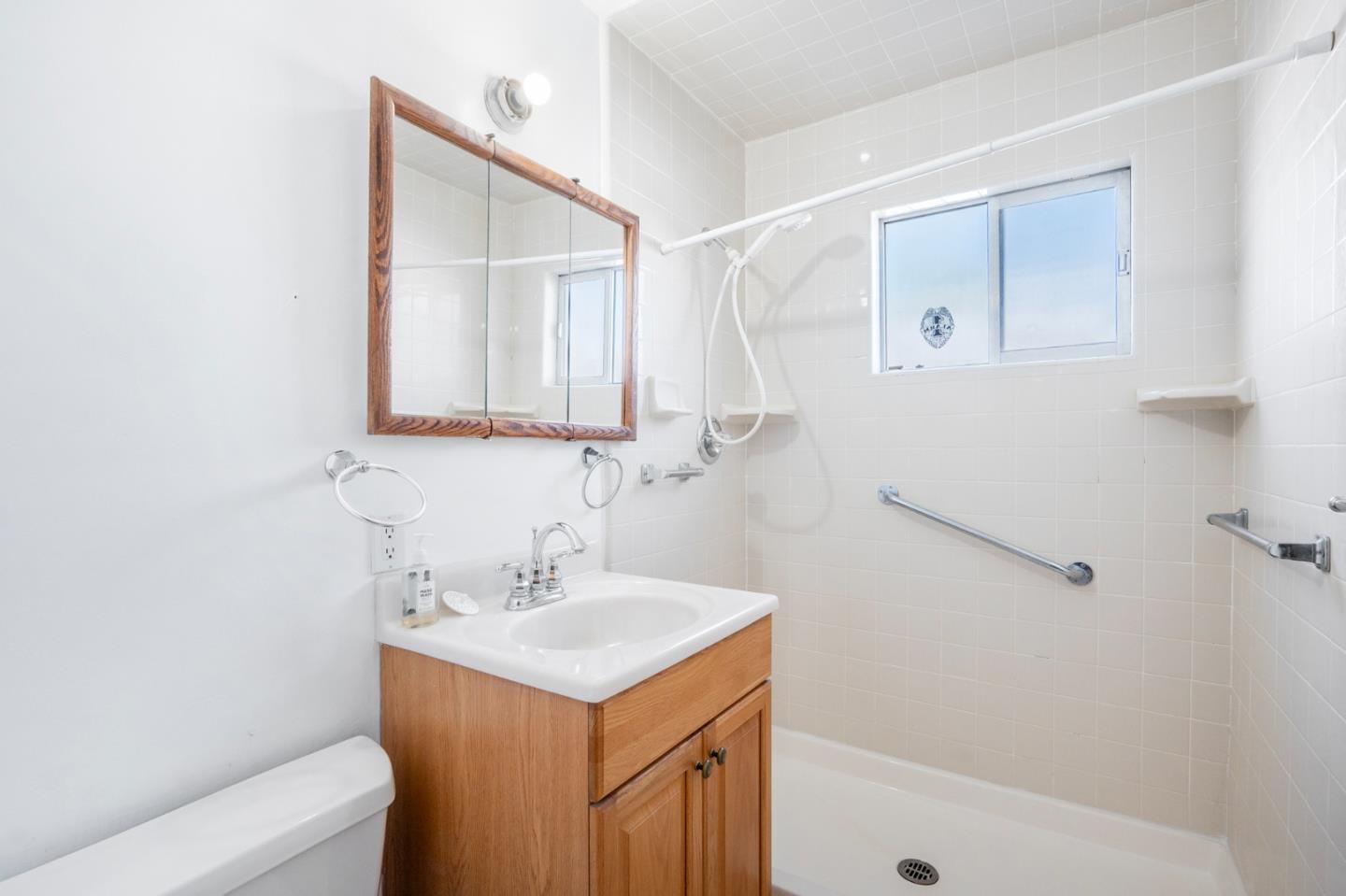 421 Fairview Drive Gilroy, CA 95020 - Photo 16 of 23 a bathroom with a sink a mirror and a shower