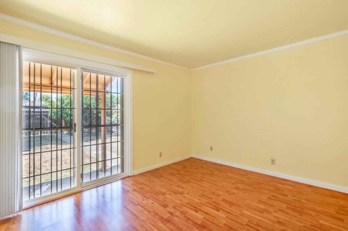 421 Fairview Drive Gilroy, CA 95020 - Photo 17 of 23 a view of empty room with wooden floor and fan