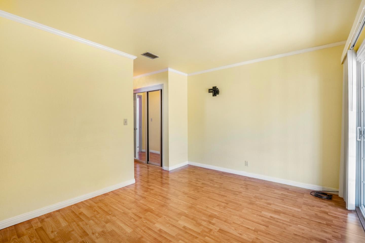 421 Fairview Drive Gilroy, CA 95020 - Photo 18 of 23 an empty room with wooden floor and a window