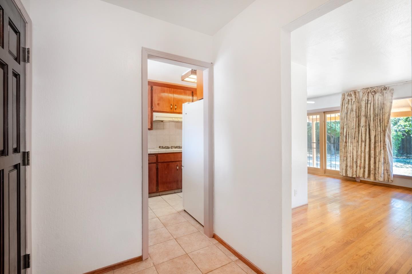 421 Fairview Drive Gilroy, CA 95020 - Photo 4 of 23 a view of a hallway with wooden floor and a room