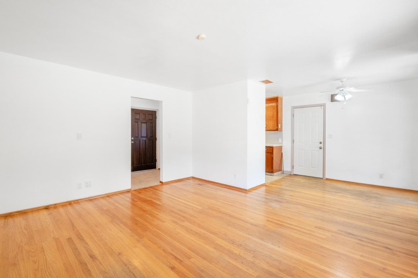 421 Fairview Drive Gilroy, CA 95020 - Photo 6 of 23 a view of an empty room with wooden floor