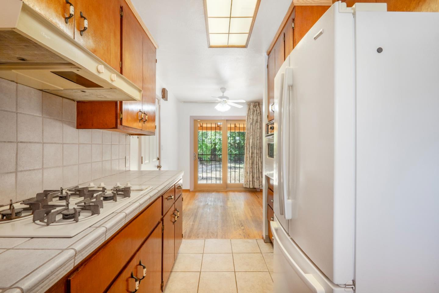 421 Fairview Drive Gilroy, CA 95020 - Photo 8 of 23 a view of a kitchen cabinets and a stove
