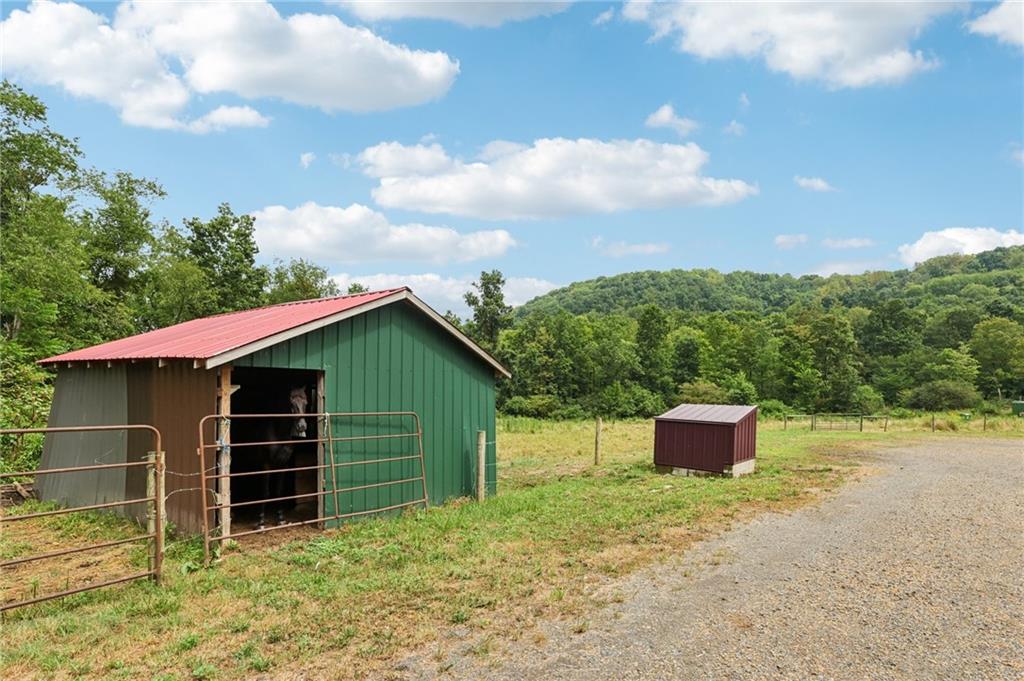 1056 Dora Road Punxsutawney, PA 15767 - Photo 17 of 50 a house with trees in the background