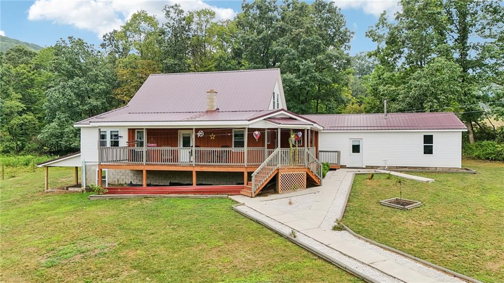1056 Dora Road Punxsutawney, PA 15767 - Photo 2 of 50 a view of a house with pool and a yard