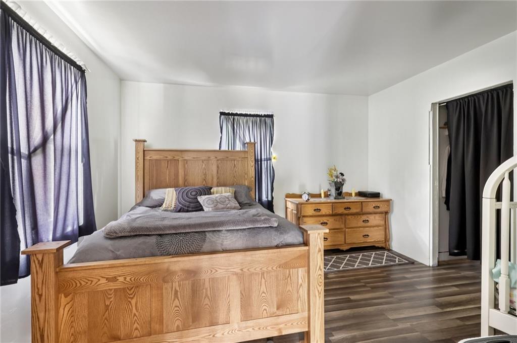 1056 Dora Road Punxsutawney, PA 15767 - Photo 31 of 50 a bedroom with a bed and a dresser with wooden floor