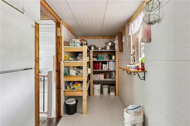 a view of a hallway with seating area