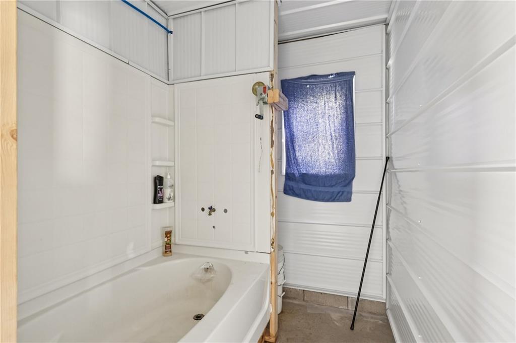 1056 Dora Road Punxsutawney, PA 15767 - Photo 40 of 50 a bathroom with a bathtub and shower