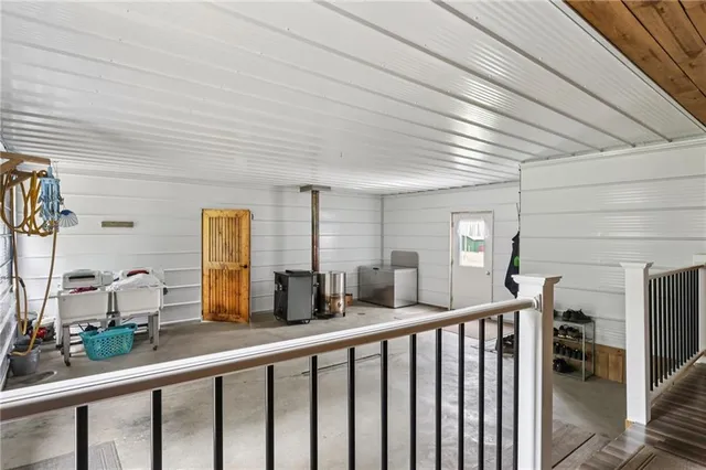 a view of a livingroom with furniture and a window