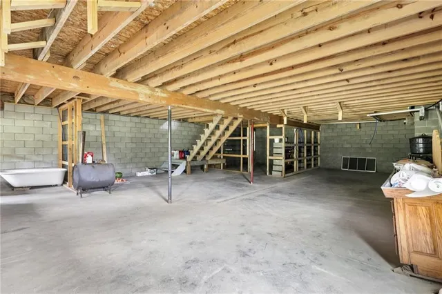 a view of an empty room with stairs