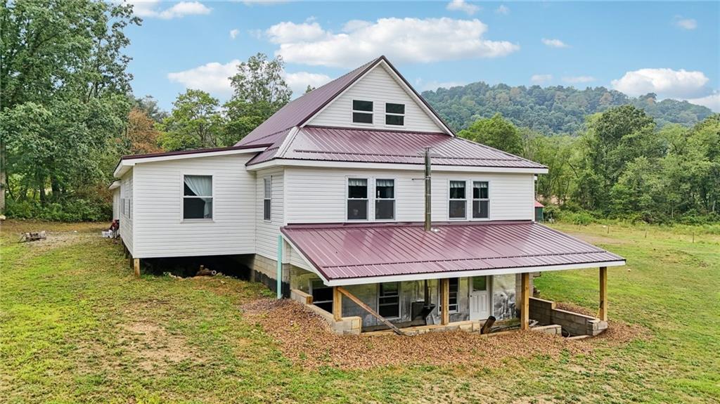 1056 Dora Road Punxsutawney, PA 15767 - Photo 7 of 50 a front view of a house with a garden