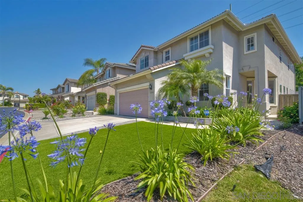 11574 Village Ridge Road San Diego, CA 92131 - Photo 1 of 25 front view of a house with a big yard