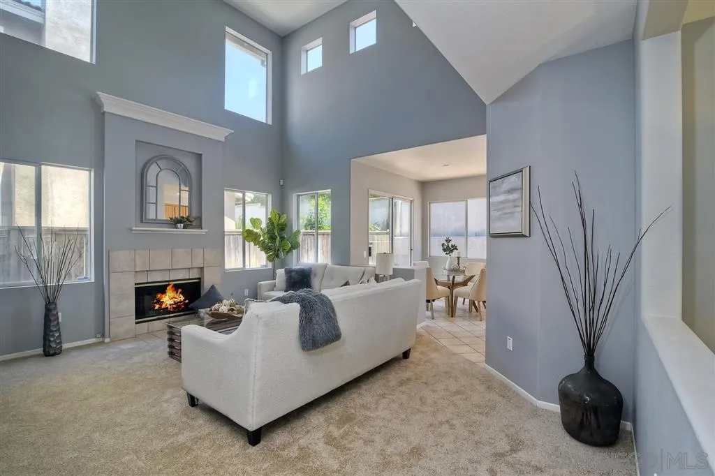 11574 Village Ridge Road San Diego, CA 92131 - Photo 11 of 25 a living room with furniture and a fireplace