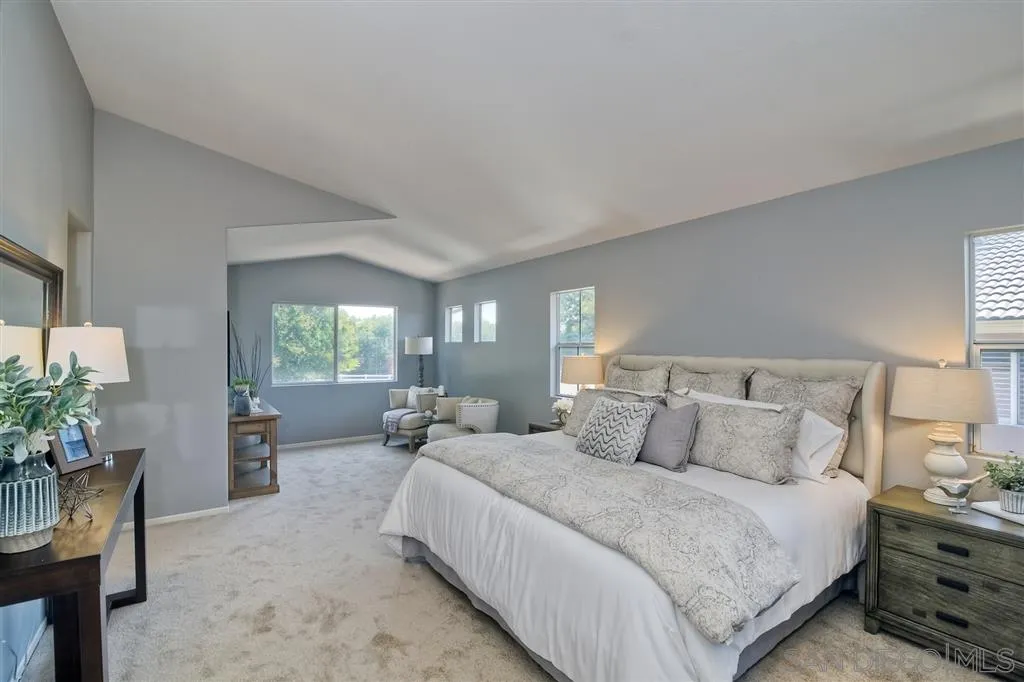11574 Village Ridge Road San Diego, CA 92131 - Photo 14 of 25 a bedroom with bed and large windows