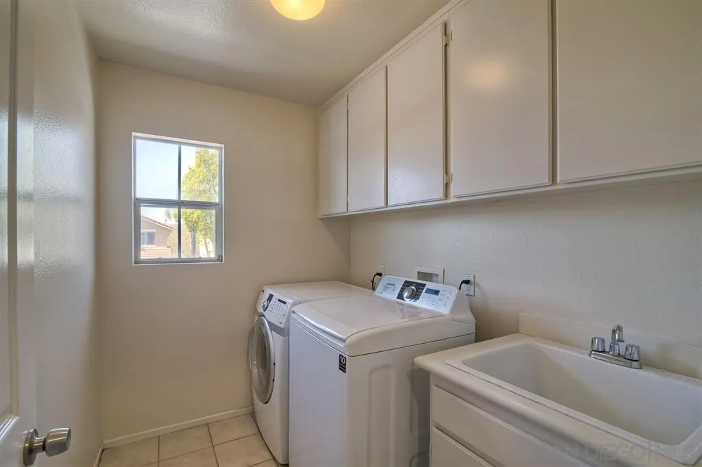 11574 Village Ridge Road San Diego, CA 92131 - Photo 20 of 25 a utility room with dryer and washer