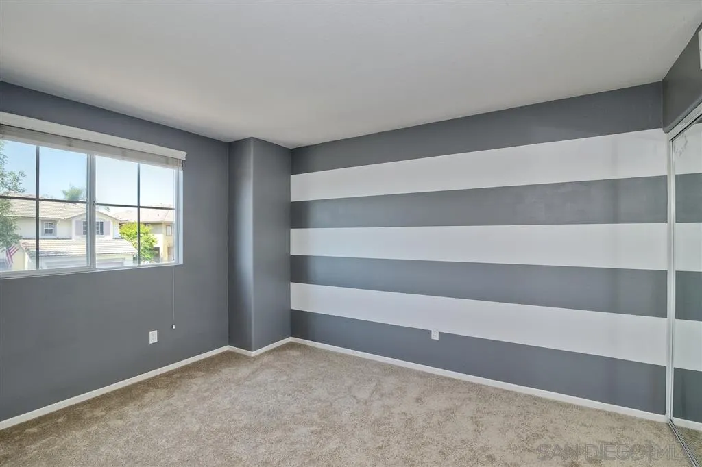 11574 Village Ridge Road San Diego, CA 92131 - Photo 21 of 25 a view of an empty room with a window