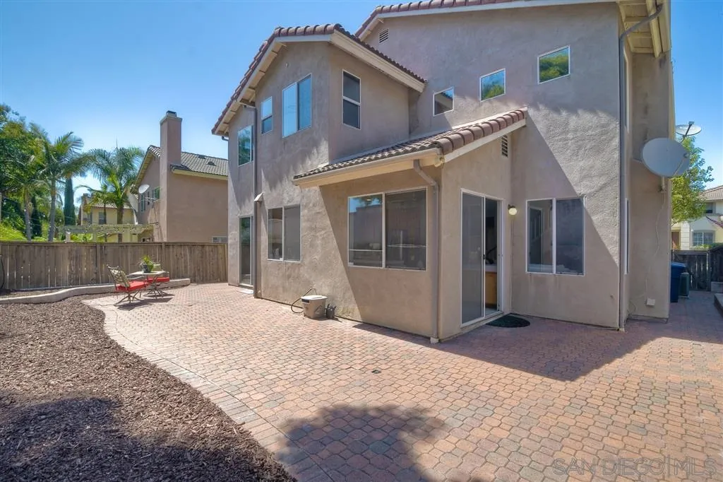 11574 Village Ridge Road San Diego, CA 92131 - Photo 23 of 25 a view of a house with backyard