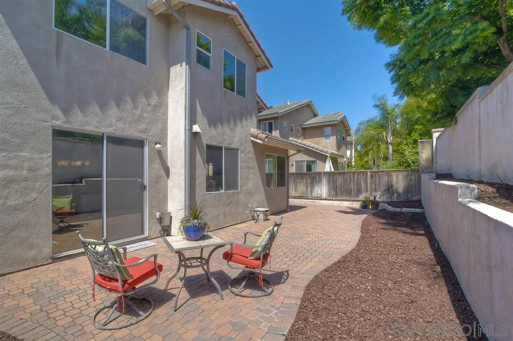11574 Village Ridge Road San Diego, CA 92131 - Photo 24 of 25 a backyard of a house with outdoor seating
