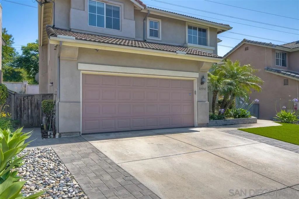 11574 Village Ridge Road San Diego, CA 92131 - Photo 25 of 25 a view of a building with a door