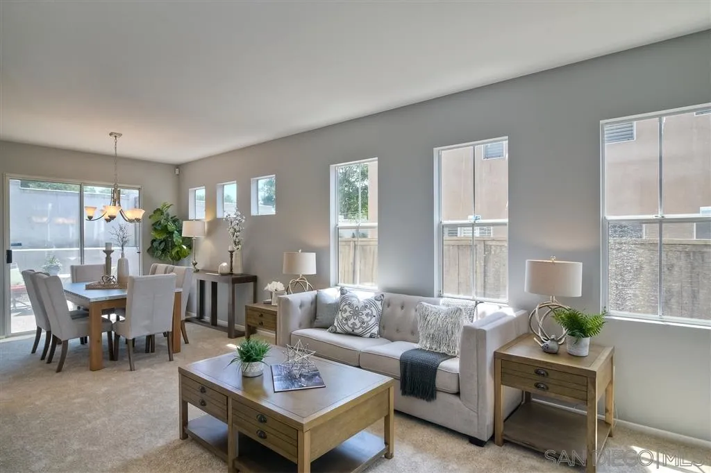 11574 Village Ridge Road San Diego, CA 92131 - Photo 3 of 25 a living room with furniture and a large window