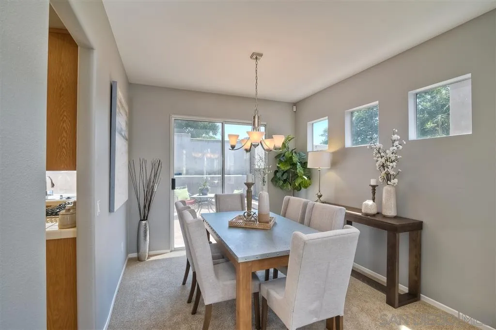 11574 Village Ridge Road San Diego, CA 92131 - Photo 5 of 25 a dining room with furniture and window