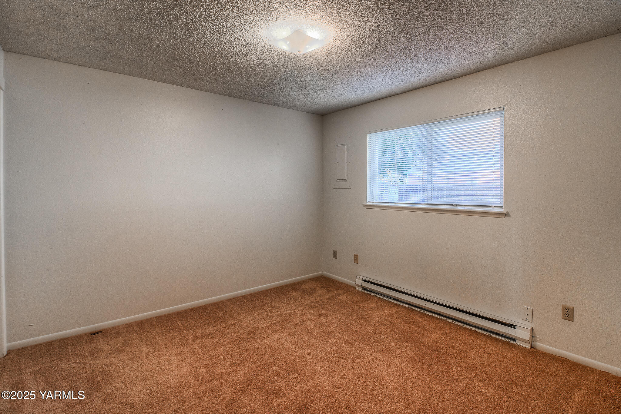 104 Moxee Avenue Naches, WA 98937 - Photo 17 of 22 an empty room with a workbench