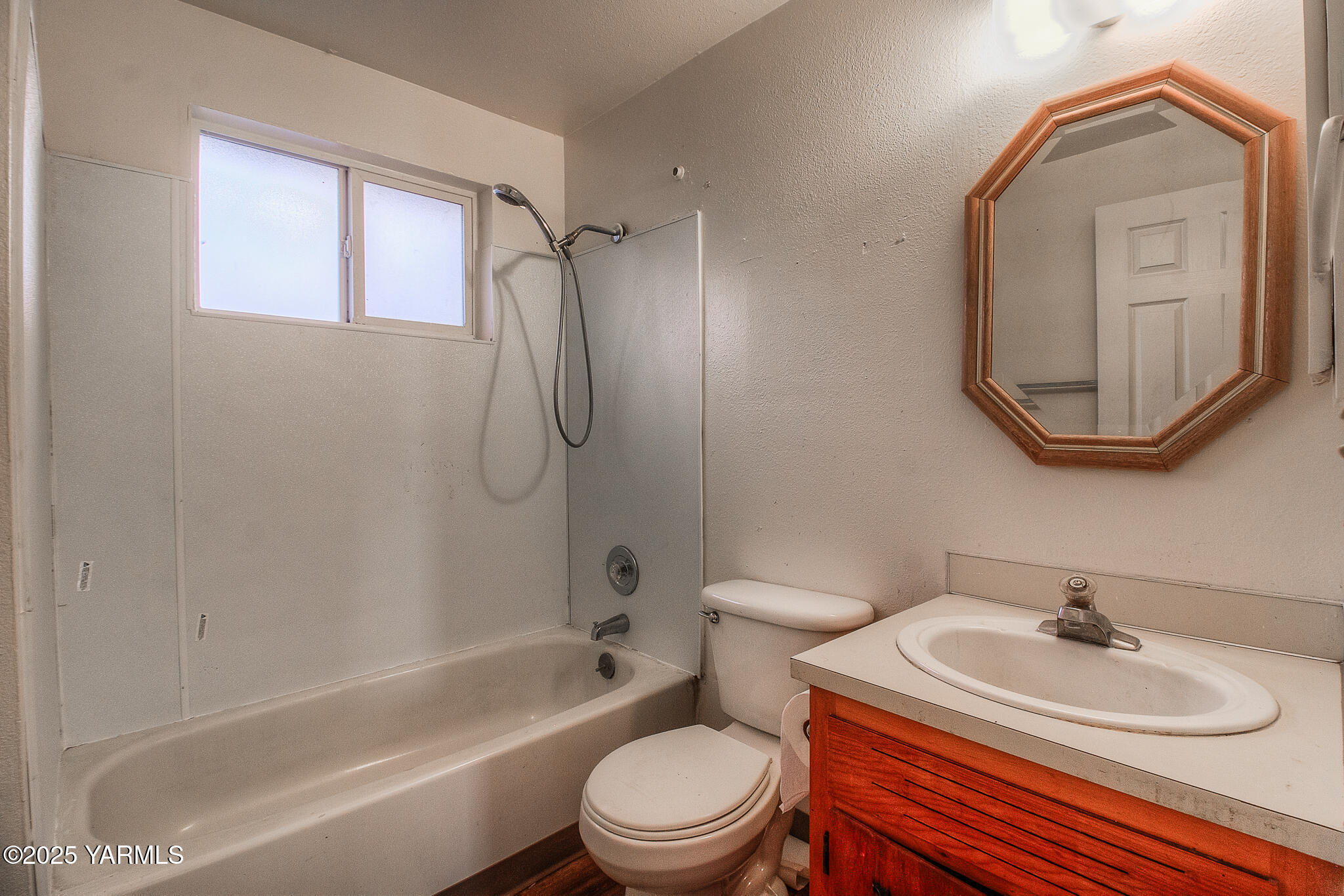 104 Moxee Avenue Naches, WA 98937 - Photo 21 of 22 a bathroom with a sink toilet a mirror and shower
