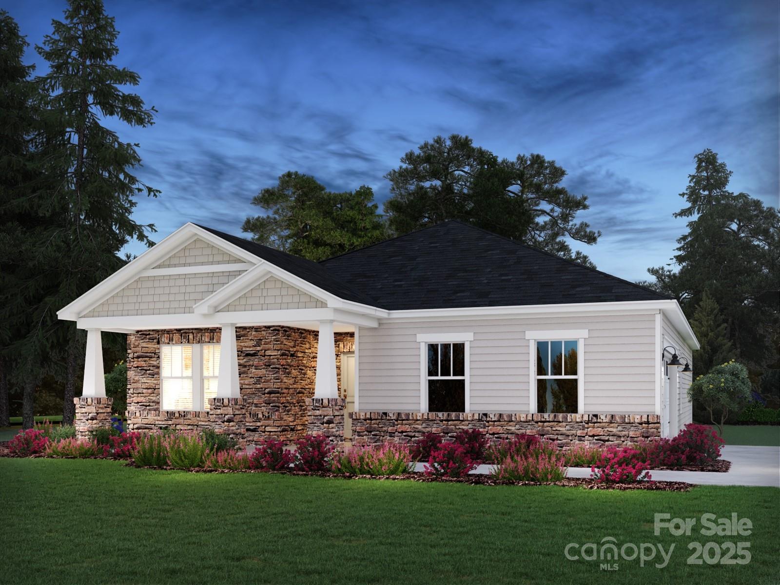 a front view of a house with a garden
