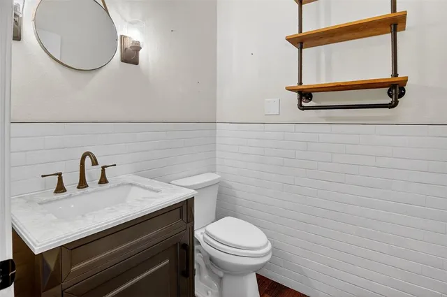 a bathroom with a sink and vanity