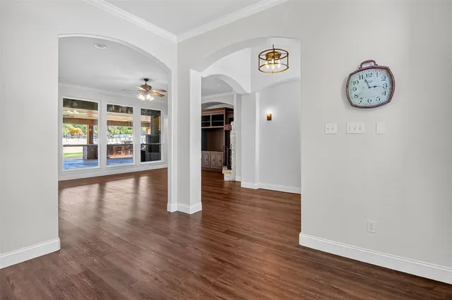 a view of a room with wooden floor and a fireplace