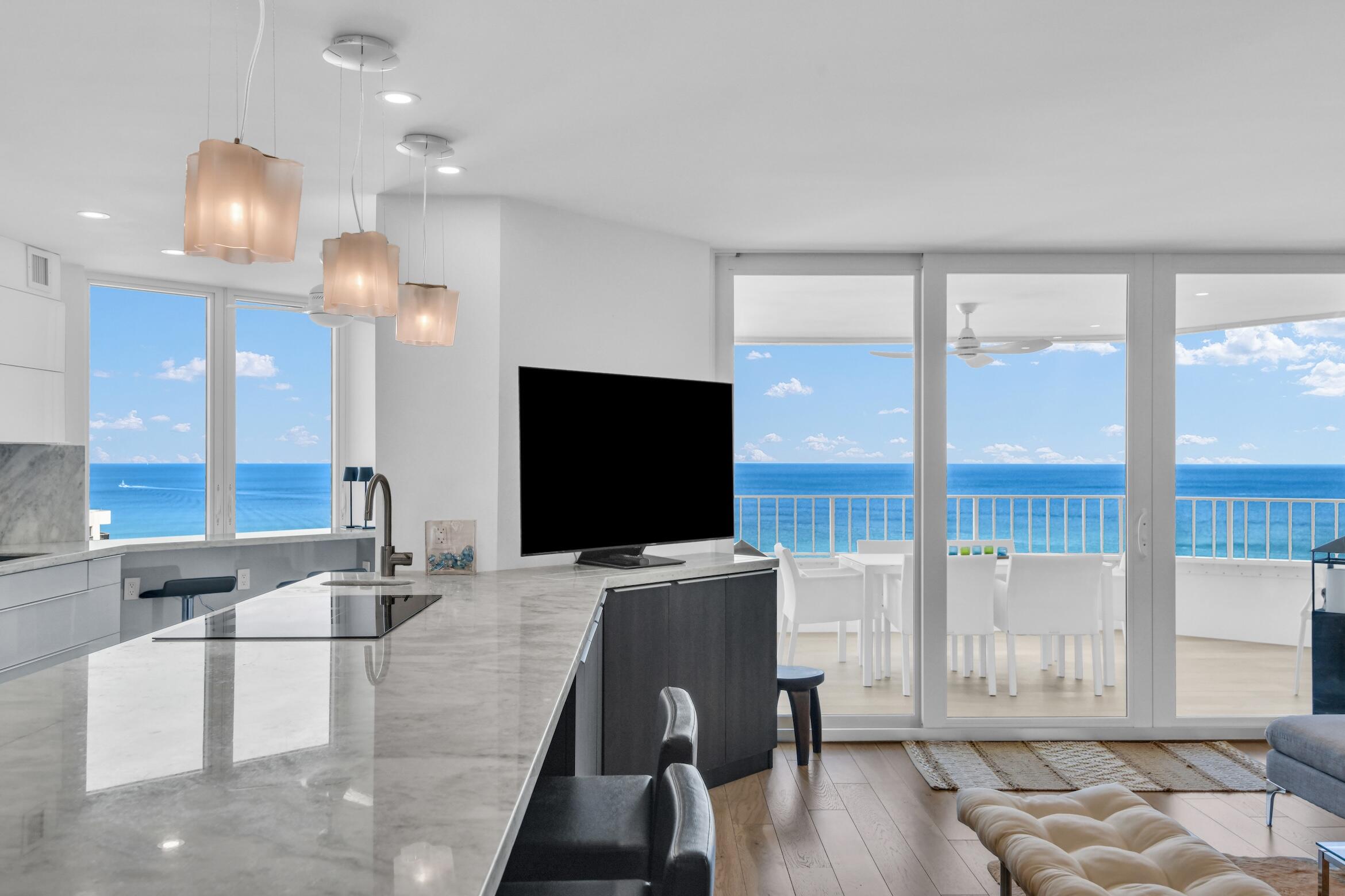 500 South Ocean Boulevard, Unit 1905 Boca Raton, FL 33432 - Photo 12 of 73 a living room with furniture and a flat screen tv