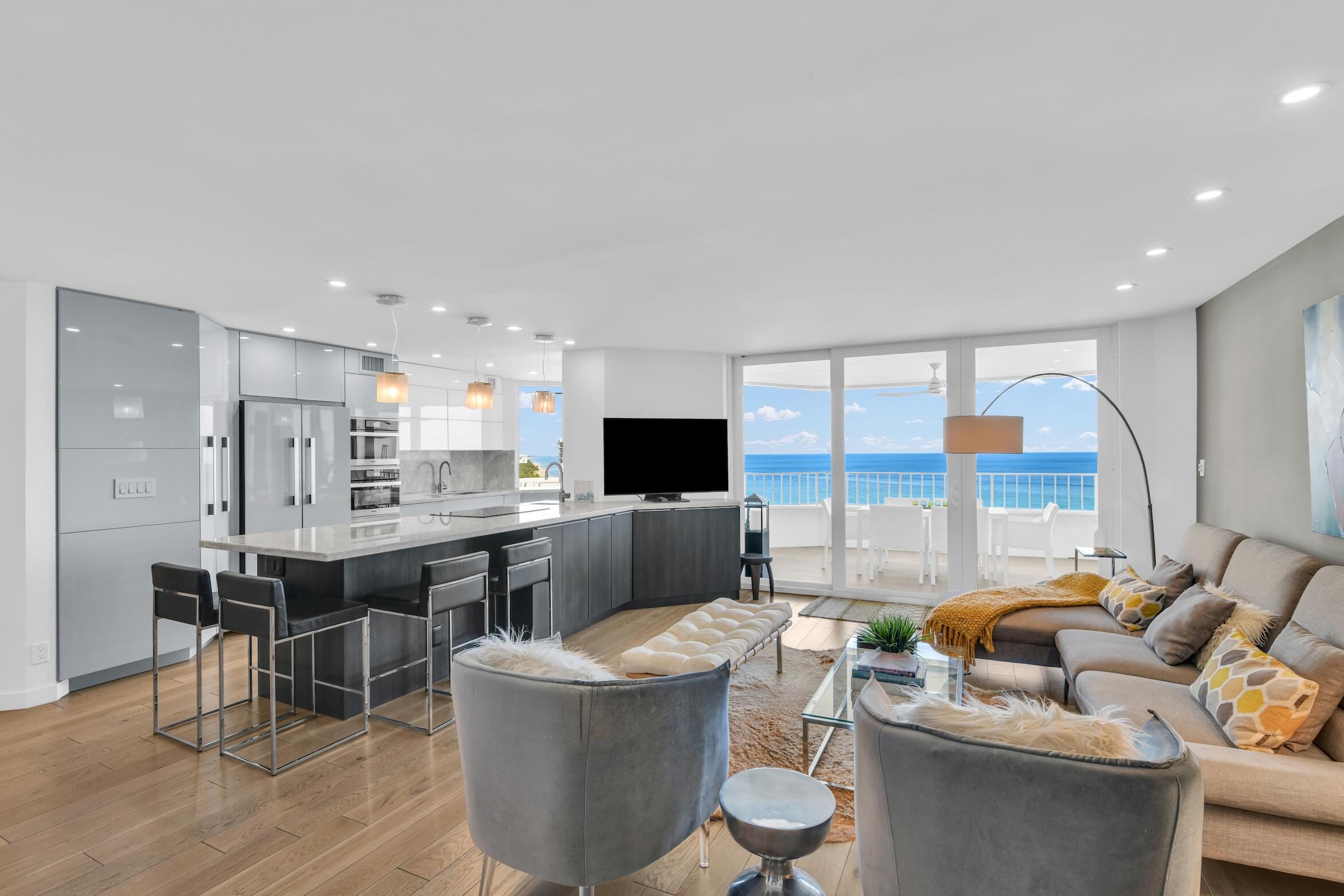 500 South Ocean Boulevard, Unit 1905 Boca Raton, FL 33432 - Photo 13 of 73 a living room with furniture kitchen view and a large window