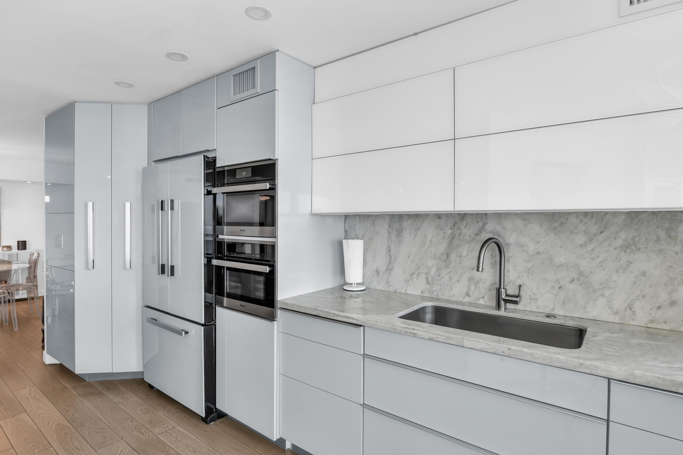 500 South Ocean Boulevard, Unit 1905 Boca Raton, FL 33432 - Photo 16 of 73 a kitchen with stainless steel appliances a refrigerator and a sink