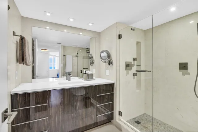 a view of a dining room with furniture and a large window