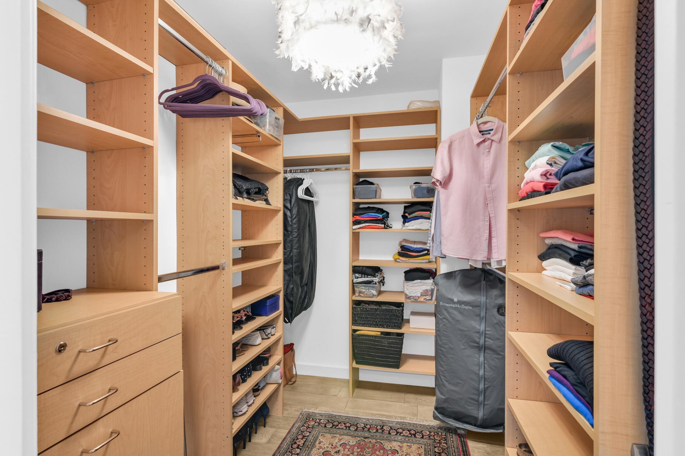 500 South Ocean Boulevard, Unit 1905 Boca Raton, FL 33432 - Photo 25 of 73 a view of walk in closet with clothes and shoes