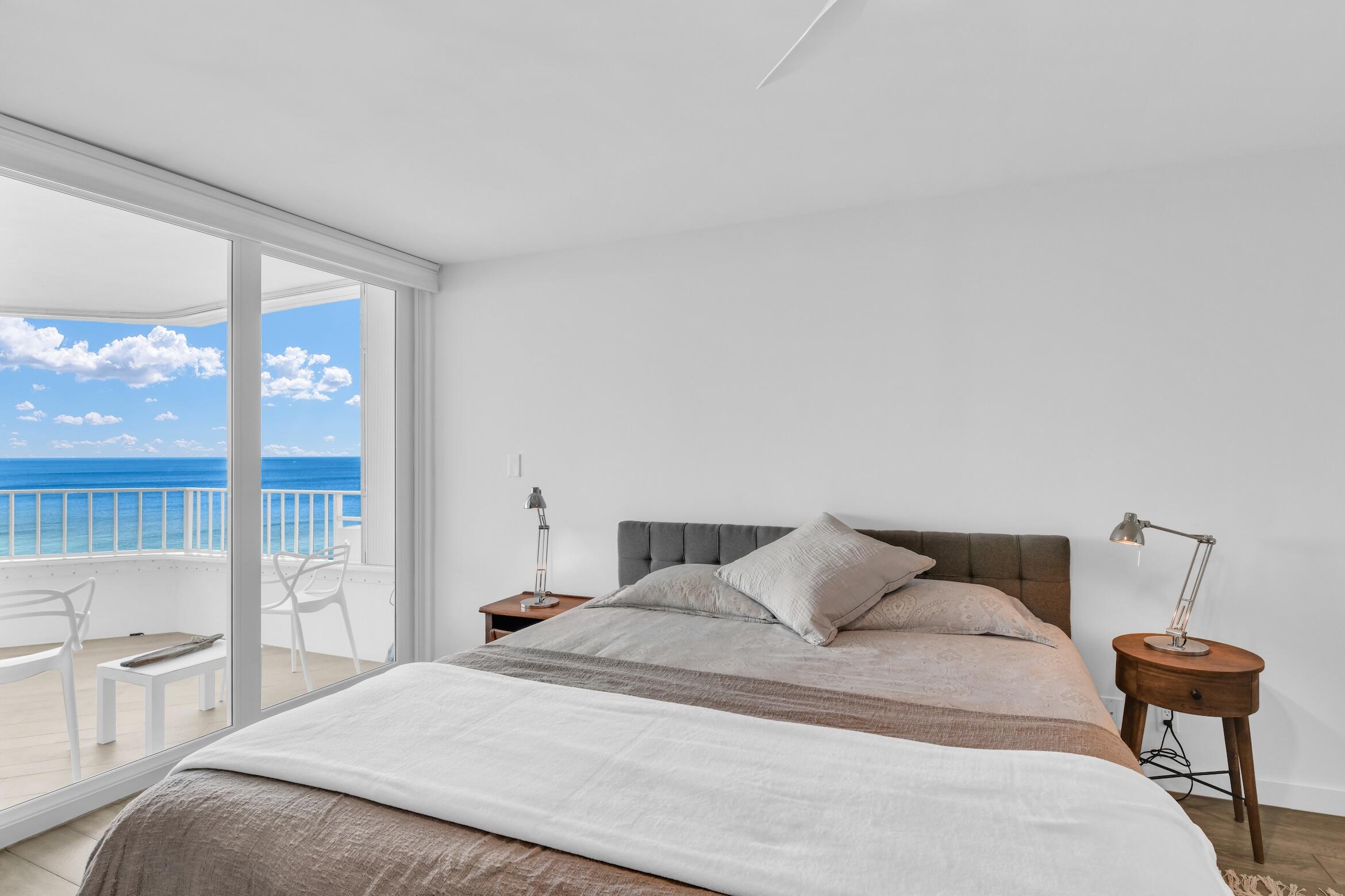 500 South Ocean Boulevard, Unit 1905 Boca Raton, FL 33432 - Photo 29 of 73 a bedroom with a bed and large window