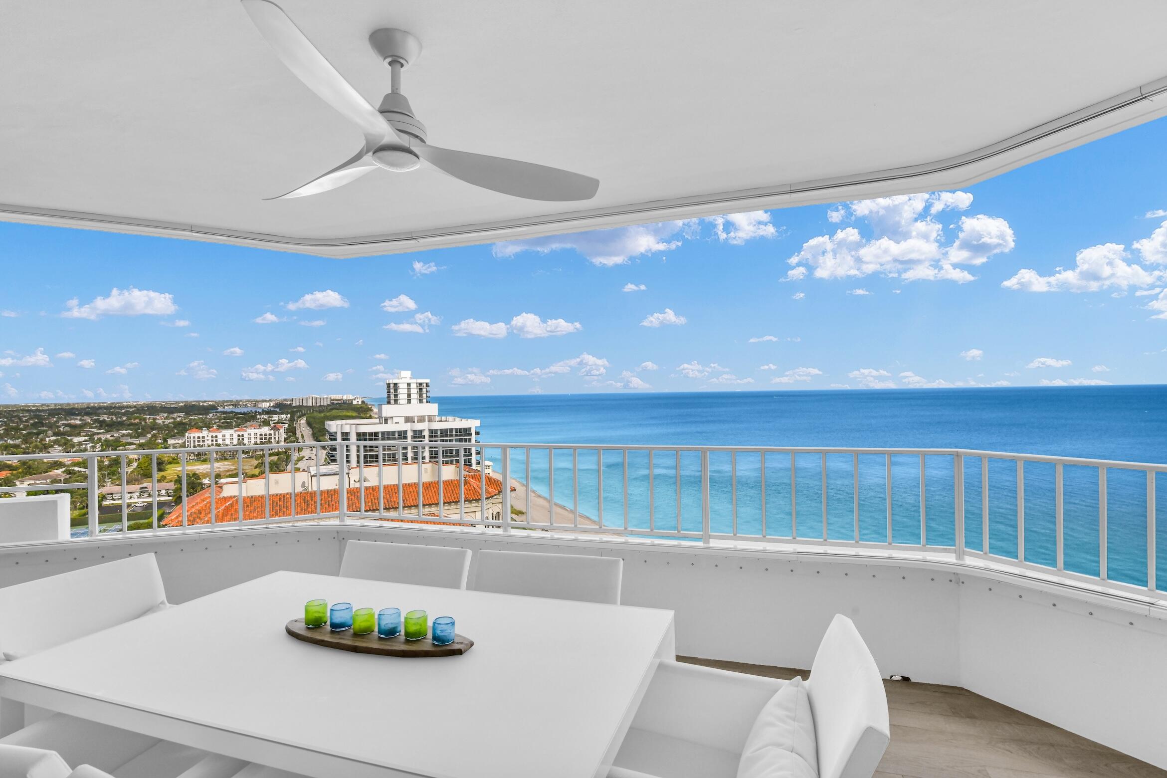 500 South Ocean Boulevard, Unit 1905 Boca Raton, FL 33432 - Photo 32 of 73 a view of a dining room with furniture and a floor to ceiling window