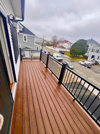 a view of balcony with wooden floor
