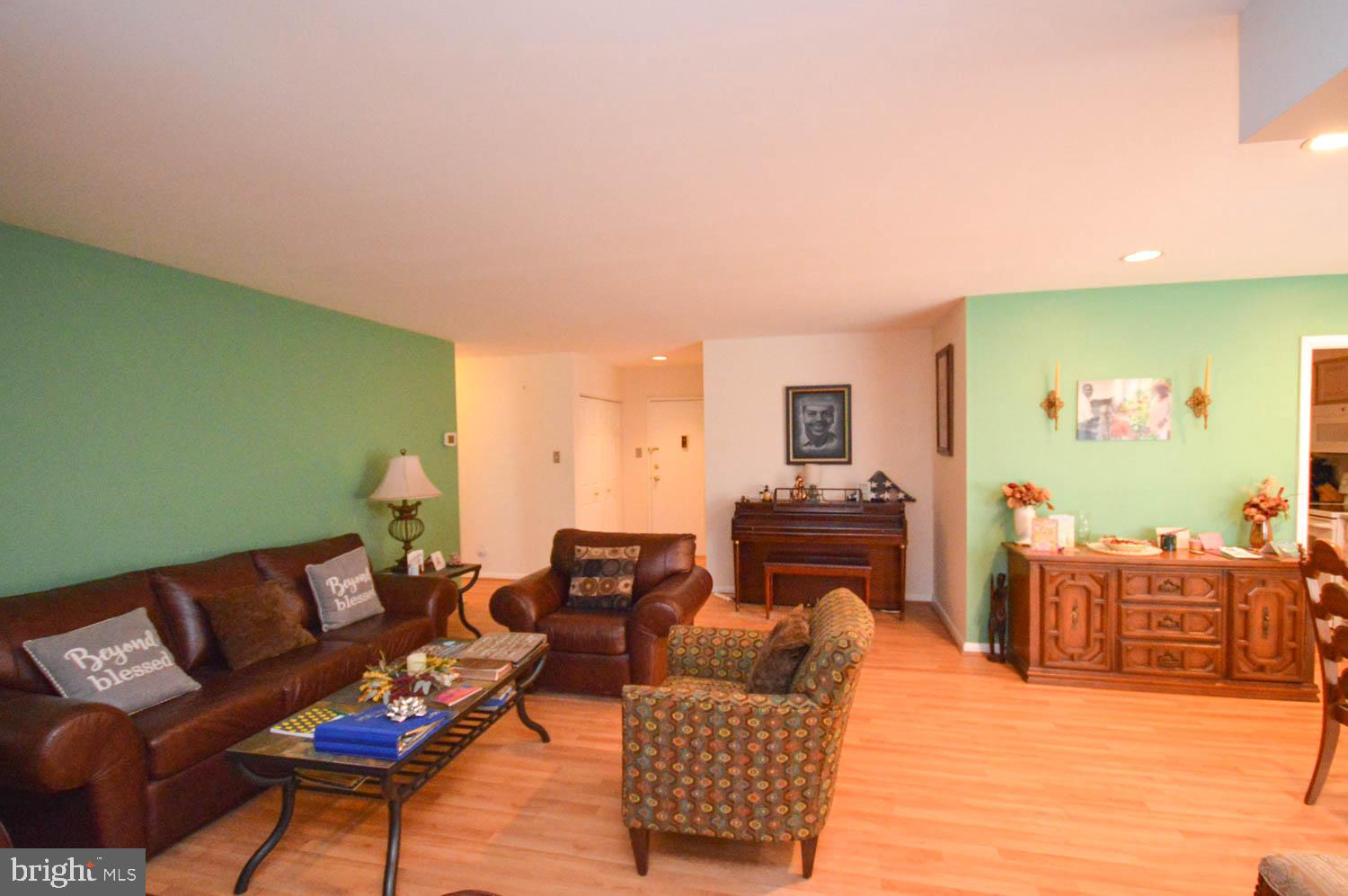 6317 Park Heights Avenue, Unit 310 Baltimore, MD 21215 - Photo 18 of 37 a living room with furniture and a flat screen tv