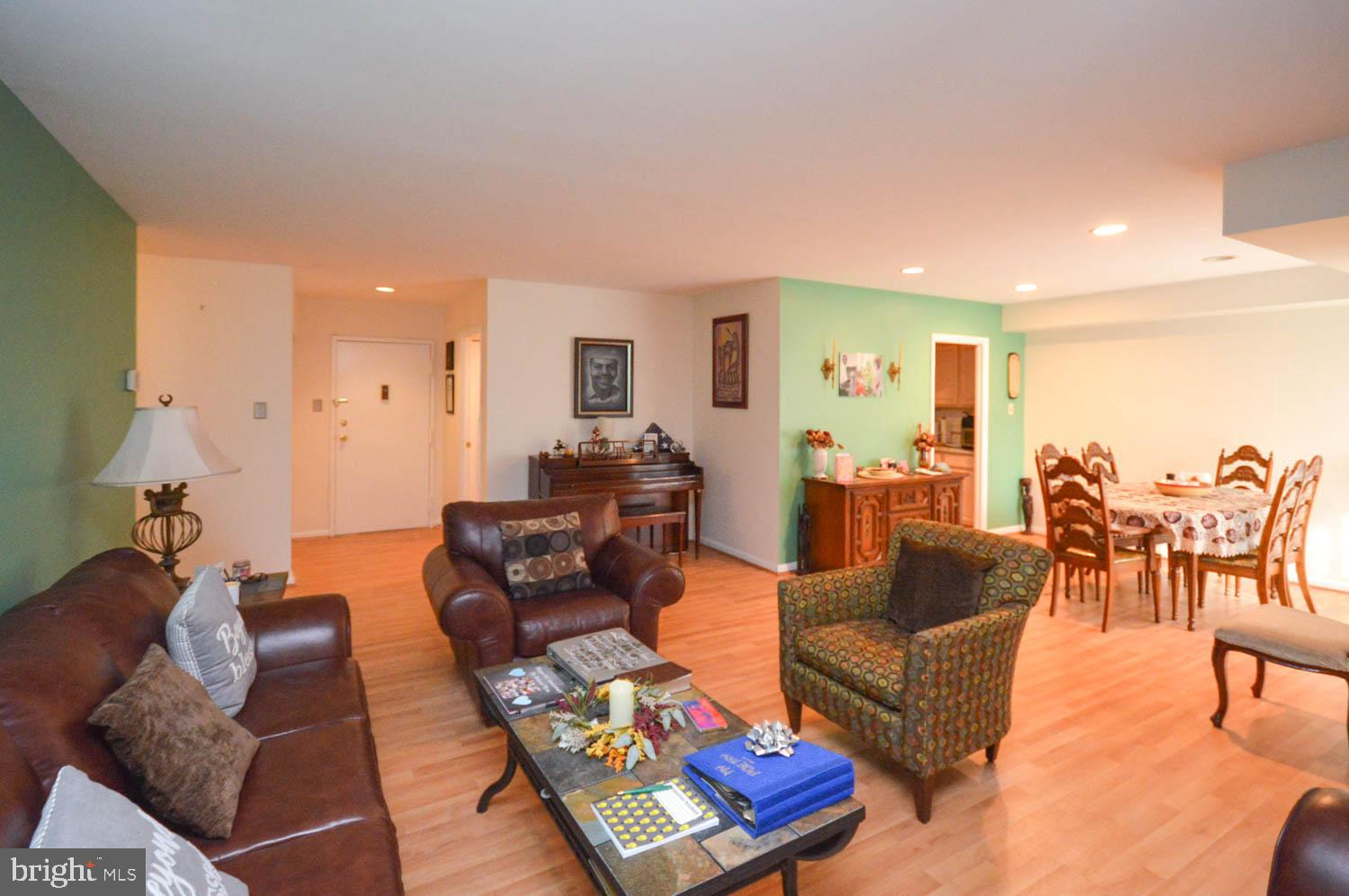 6317 Park Heights Avenue, Unit 310 Baltimore, MD 21215 - Photo 19 of 37 a living room with furniture and a large window