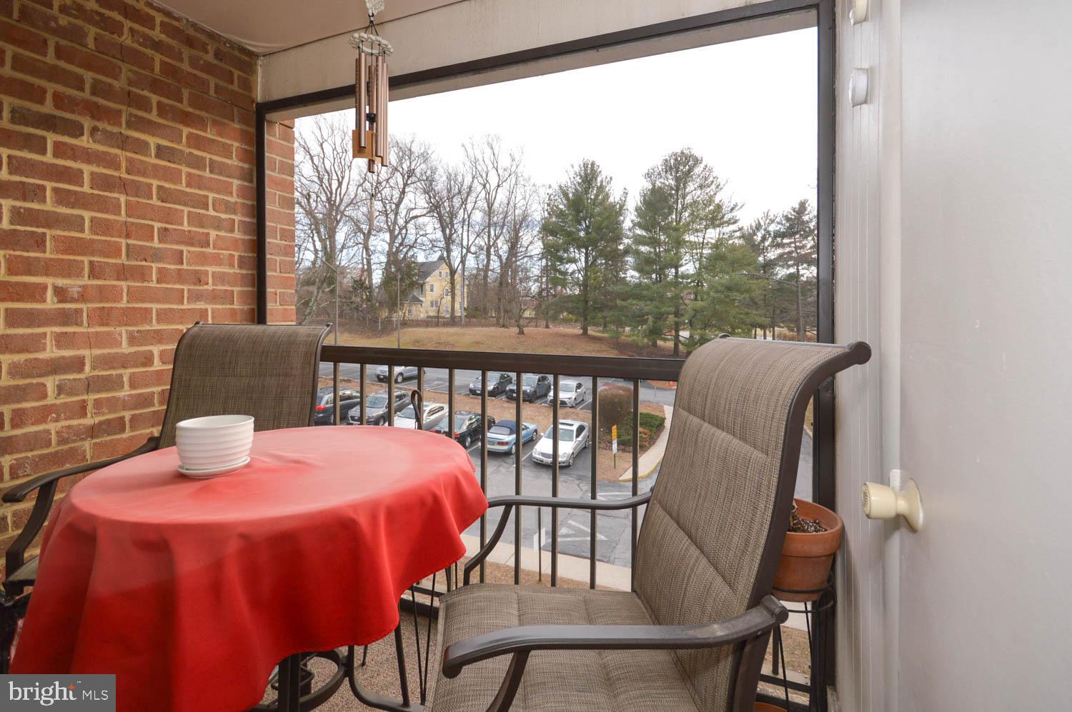6317 Park Heights Avenue, Unit 310 Baltimore, MD 21215 - Photo 25 of 37 a dining room with furniture and wooden floor