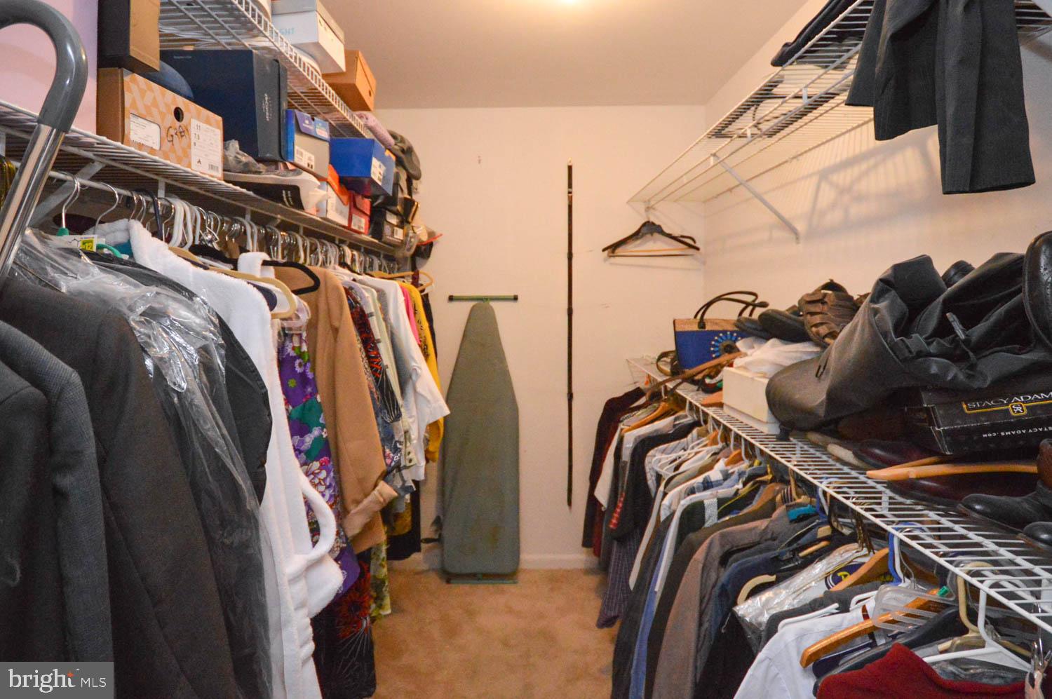 6317 Park Heights Avenue, Unit 310 Baltimore, MD 21215 - Photo 33 of 37 a view of walk in closet with clothes and shoes