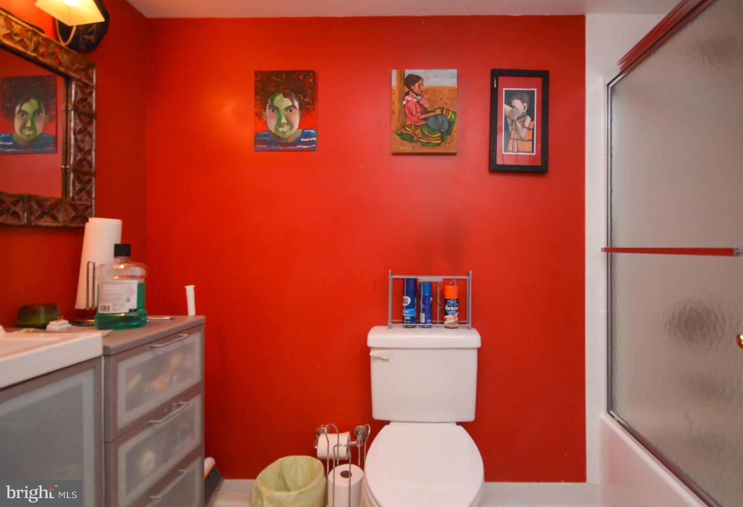 6317 Park Heights Avenue, Unit 310 Baltimore, MD 21215 - Photo 37 of 37 a white toilet sitting next to a bathroom sink
