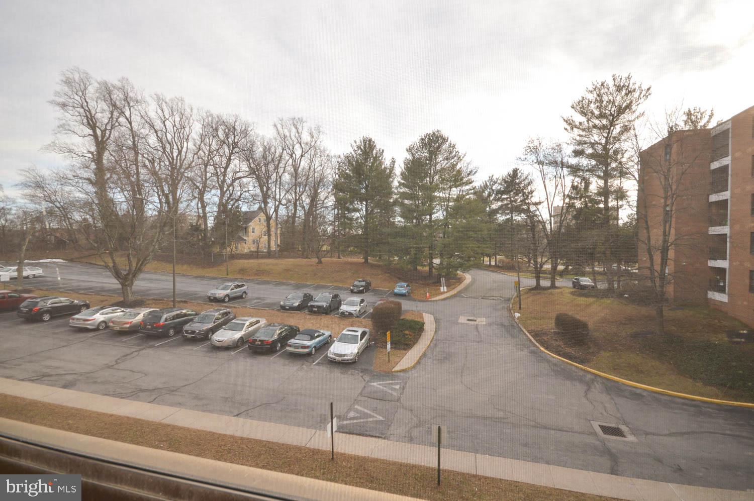 6317 Park Heights Avenue, Unit 310 Baltimore, MD 21215 - Photo 5 of 37 a backyard of water with tall trees